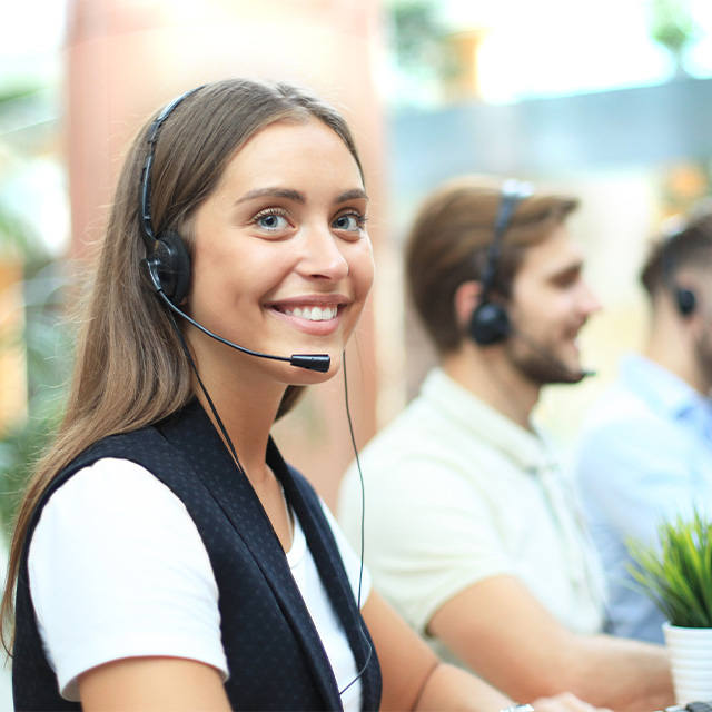 A woman answering a call at a contact center